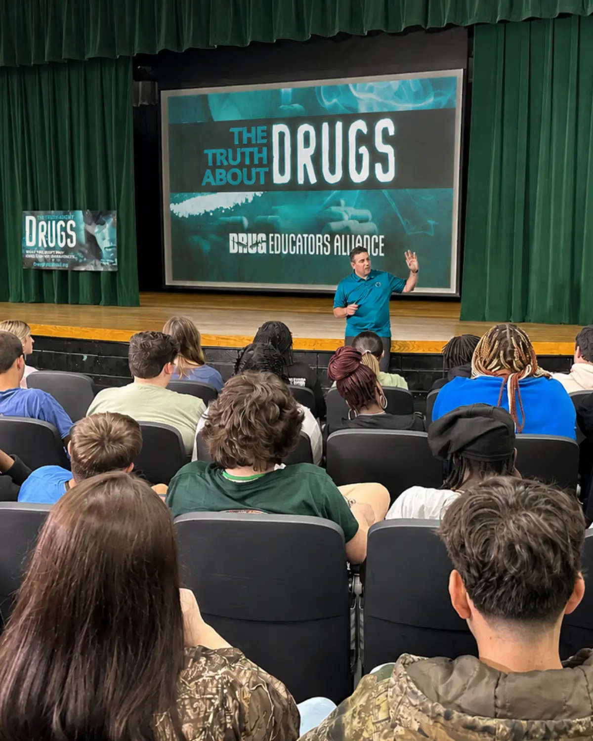 Drug education presentation in a school auditorium
